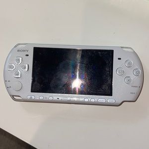 PSP with three games included all in the pictures